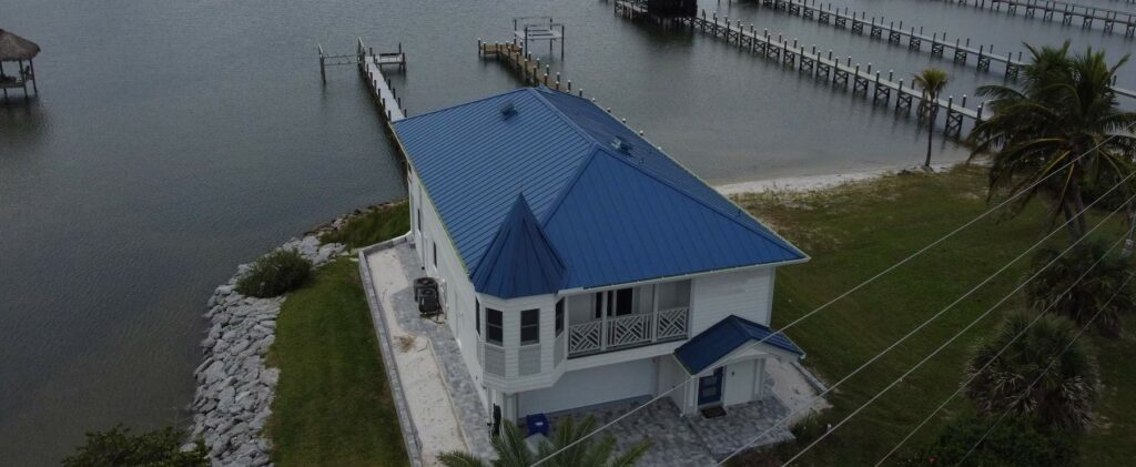 Home along Florida's coast with a blue metal roof.